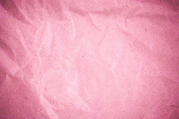 Fototapeta premium Pink crumpled recycle paper background.