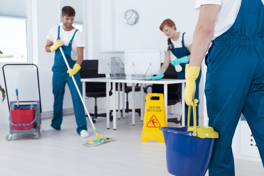 Busy professional cleaners