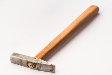 Small hammer on white background / Small hammer with wooden handle on white background