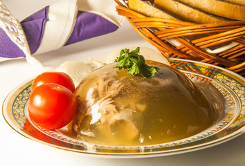 Gelatin tasty meat with tomato on a plate on the table