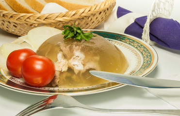 Gelatin tasty meat with tomato on a plate on the table