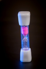 hourglass isolated on black.