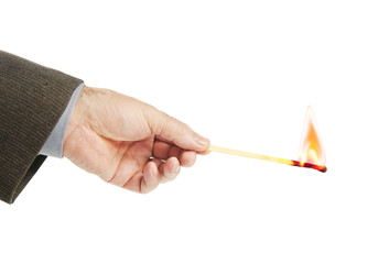 Man holds burning match