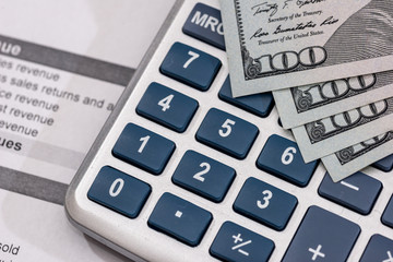 Save money concept - utility bill with pen, calculator and us dollar.