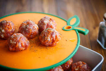 raw meatballs tangled meat with carrots