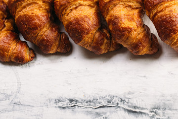 Fresh baked croissants on white background