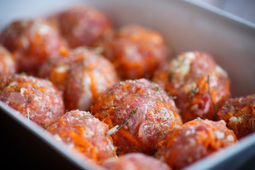 raw meatballs tangled meat with carrots