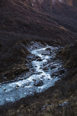 Stream with ice flowing down from the mountains
