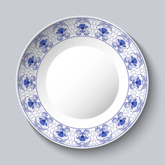 Decorative porcellaneous dish with blue floral pattern in ethnic style Chinese painting on porcelain or Russian style Gzhel.