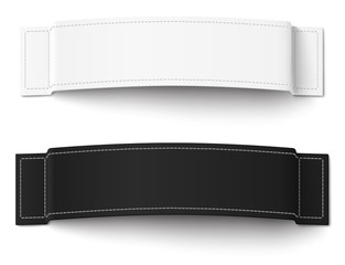 Two, white and black, fabric labels with stitching isolated