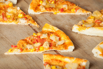 Fresh pizza with cheese on wood desk. 