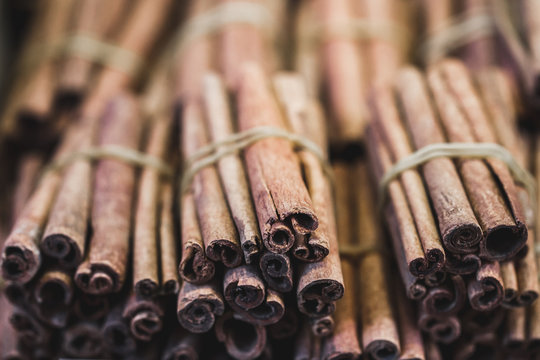 Stack of cinnamon sticks on the counter market