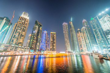 Fototapeta na wymiar Dubai Marina skyscrapers reflections at night, UAE
