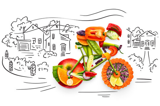 Fototapeta Fruity biker / Healthy food concept of a cyclist riding a bike made of fresh vegetables and fruits, on sketchy background. 