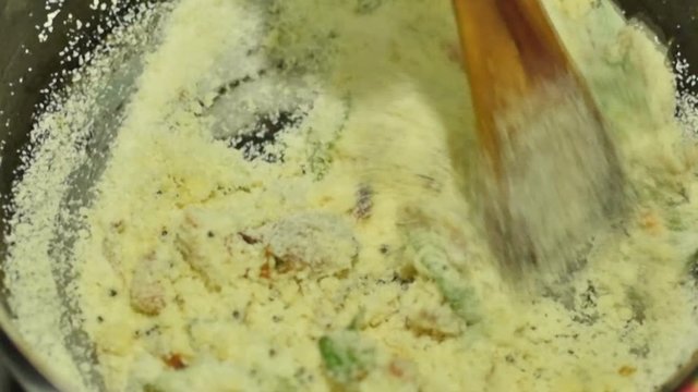 Preparation of Upma, a traditional south Indian breakfast food dish. It is made of Rava, which is called Suji in popular Hindi Language in India and cream of wheat in English. Upma is Indian delicacy.