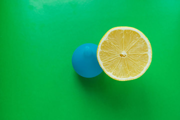 Blue medical enema and fresh lemon - dieting and medical concept