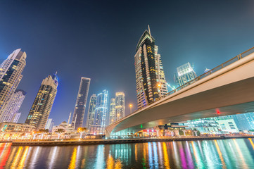 Fototapeta na wymiar Dubai Marina tall skyscrapers. Night reflections