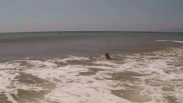 Child, Little Girl Swimming in Sea Water, young Lady plays in surf, beach