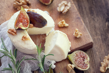 Ricotta with ripe sliced fig fruits, nuts and honey , copy space