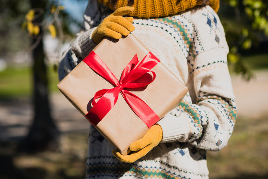 Young female holding a gift