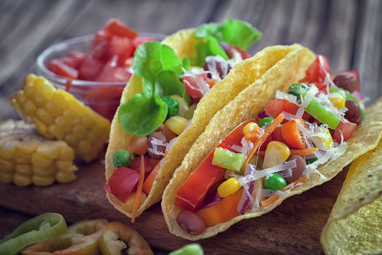 Mexican corn tortilla tacos with vegetables and chicken