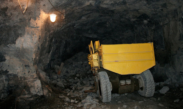 The yellow track in the underground mine in Russia.