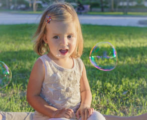 little girl smiling with delight.