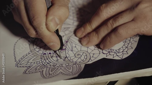 "Master tattoo transfers pattern on tracing paper. Sketch ...