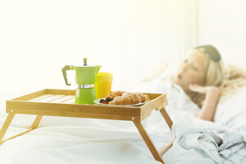 Obraz na płótnie Canvas Breakfast tray with coffee and croissant