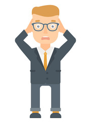 Stressful office worker clutching his head.