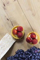 Top view tart strawberry sandwich and grape