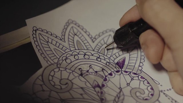 Tattoo master drawing sketch close up 4K