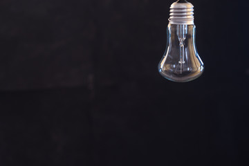 Light bulb on a dark blurred background