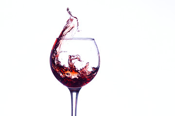 Wine splashing in glass