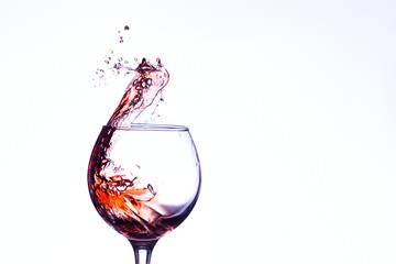 Wine splashing in glass