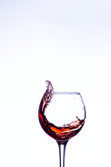 Wine splashing in glass