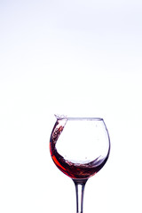 Wine splashing in glass