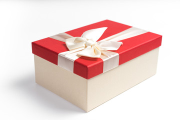 Red gift box with white ribbon isolated on white background. 