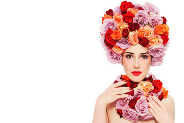 Young beautiful woman in fancy wig of colorful roses over white background, copy space