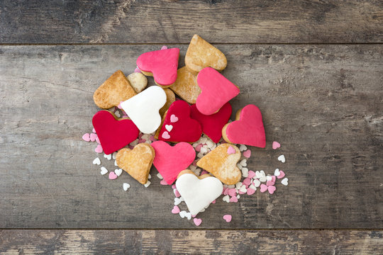Valentine cookies with heart shape on wooden background
