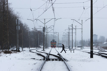 man is dangerous crosses the railroad tracks in the wrong place.