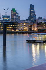 Obraz premium LONDON, ENGLAND - JUNE 17 2016: Night Photo of Thames River and skyscrapers, London, Great Britain