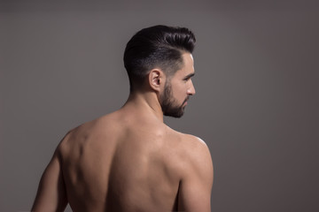 Fototapeta premium Rear view, back man muscles