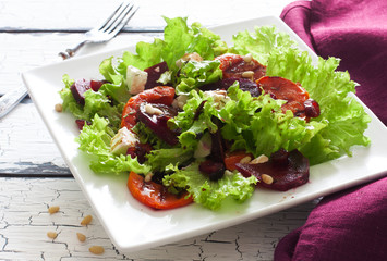 Salad with pumpkin, beet, soft cheese and lettuce