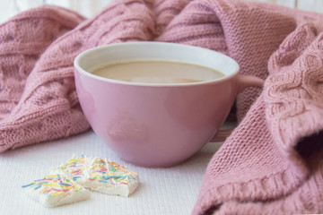Obraz na płótnie Canvas Cup of coffe and warm pink sweater