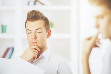 Fototapeta premium Handsome guys doing paperwork