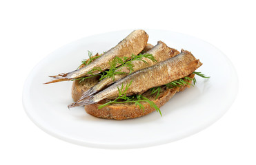 Sprats sandwiches on a plate