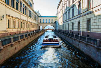 River channel with boat in Saint-Petersburg.