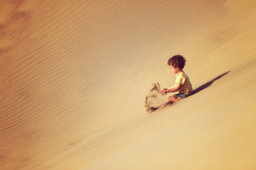 Handsome boy alone in the desert