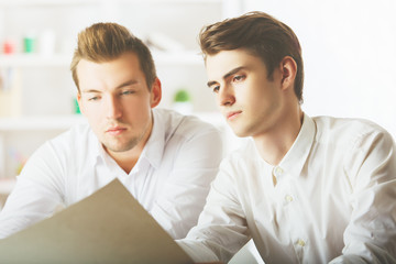 Handsome gentlemen doing paperwork